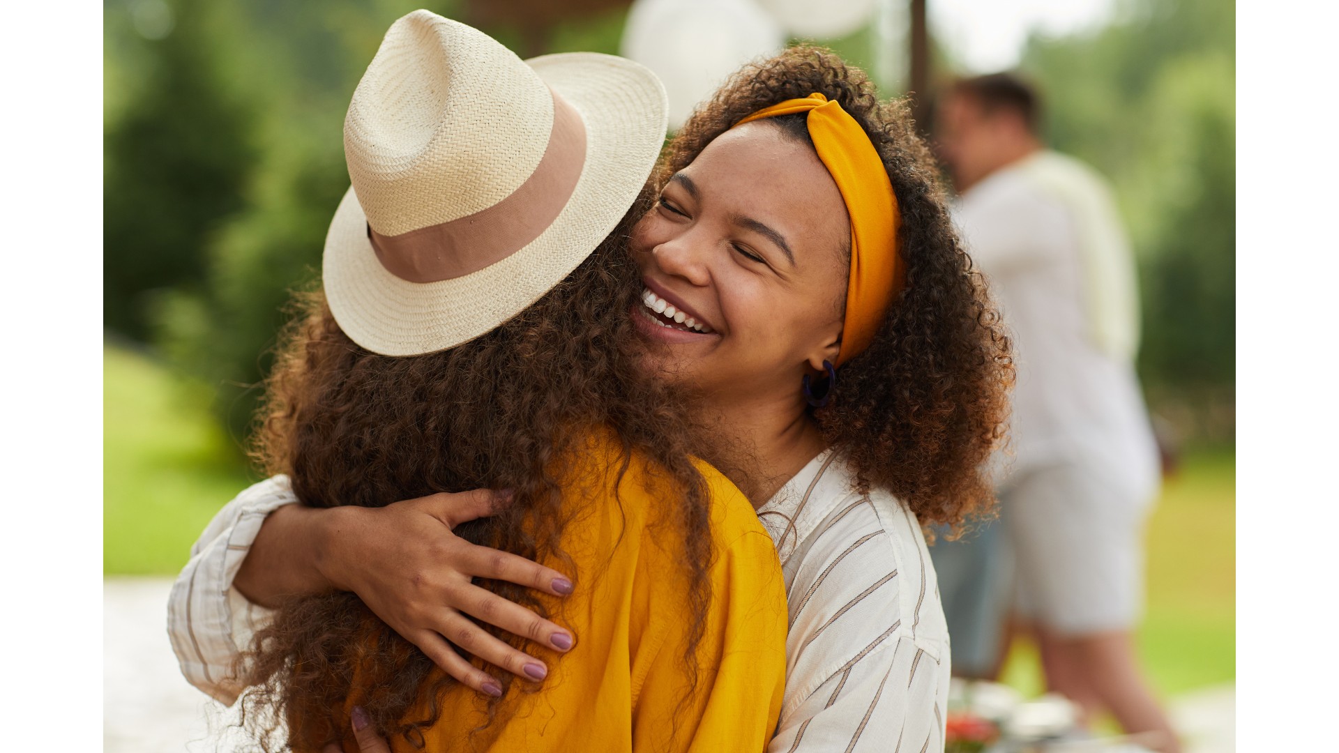 Two women embracing in a warm hug, representing casual contact that does not spread HIV